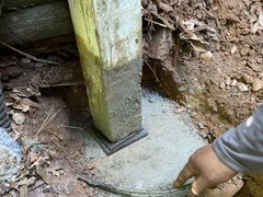 A deck support post that has settled out of position beside a Metro Atlanta home.