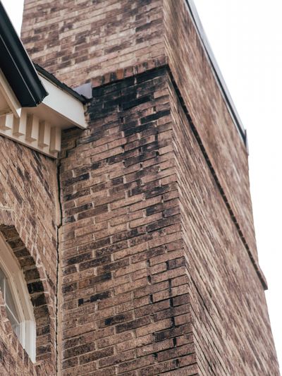 Before: Two Steel Piers Stabilize a Leaning Chimney in Marietta