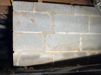 After: the same block wall with the joints filled and repointed.