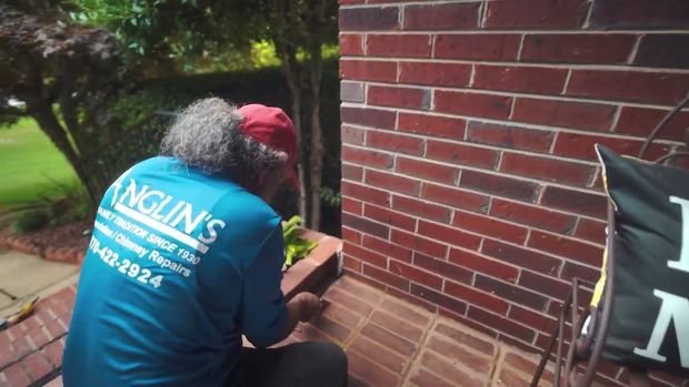 How to lift a settling cracked brick wall pulling away.