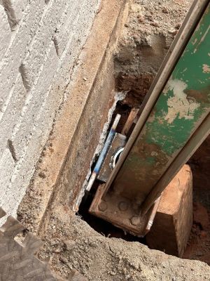 The bracket seated under the lip of the footing with the pier beam bearing on it.