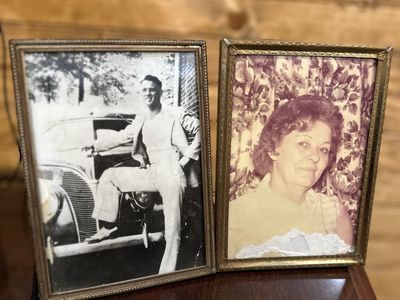 Framed photographs of Olin L. Anglin and June Bell Anglin hanging in the Anglin's office in Marietta