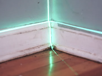A floor brought back toward level after the structure beneath it was re-supported.