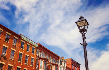 photo of a city with street lantern and buildings in the background