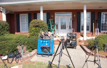 anglins gear set up in front of a house that has sinking steps