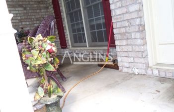 brick wall that used to be cracked under a patio door after masonry repair