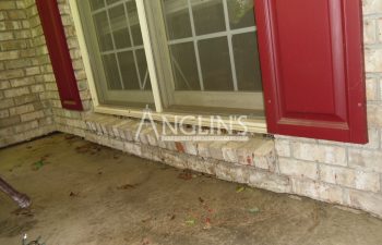brick wall cracked under the patio door
