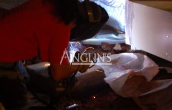 an anglin employee welding a support beam