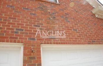 garage wall after masonry repair done by anglin's team