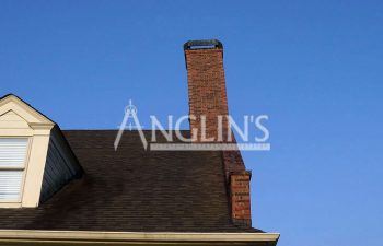 a house with a chimney that is leaning