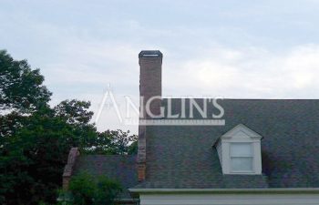 a house with a chimney that is leaning after anglin straighten it