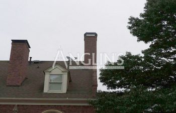 photo of a house with two chimneys