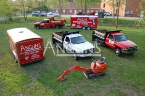 photo of anglins vehicle fleet with 3 trucks, 2 trailers and a mini crane