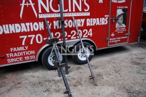 anglins trailer with 3 drills leand agains it