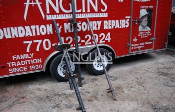 anglins trailer with 3 drills leand agains it