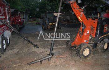 helical piers next to anglin's truck