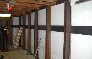 steel brackets installed along interior walls to support sinking floor