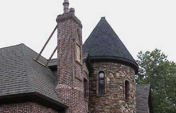 metal supports installed to striaghten a tilt chimney