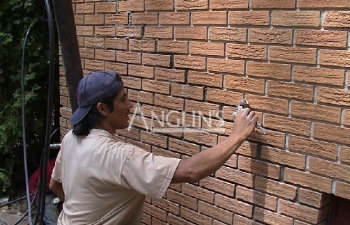 man repairs the foundation